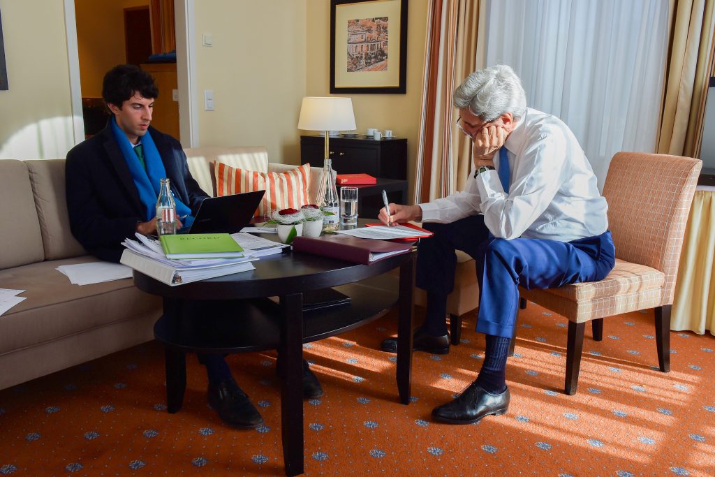 Speechwriter Andrew Imbrie and U.S. Secretary of State John Kerry work on a speech